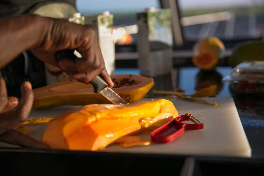 Fresh papaya being prepared in the galley