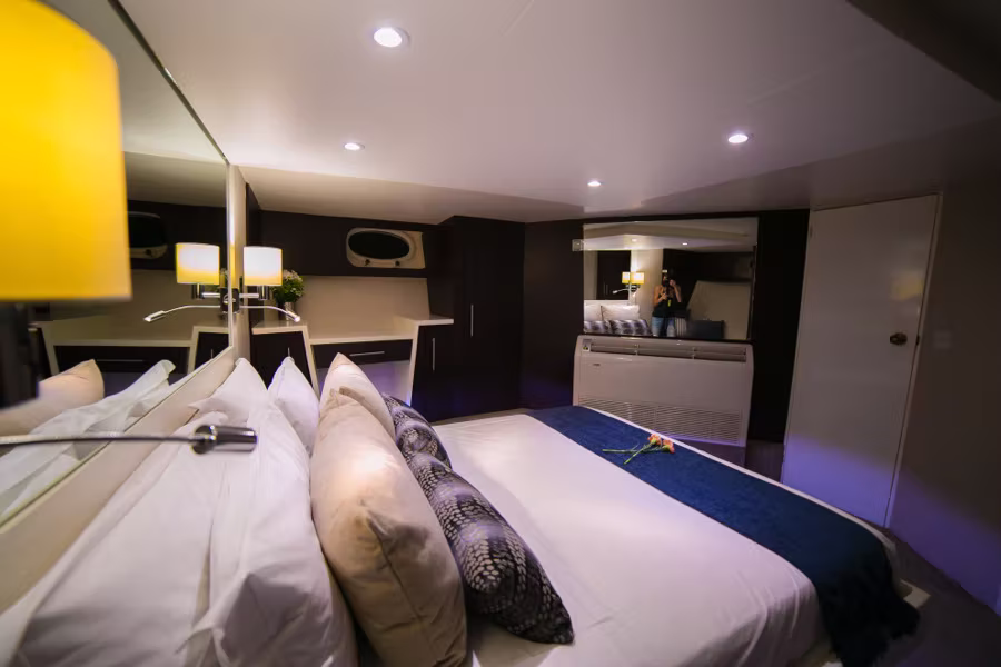The Bow Cabin, with its queen bed and navy throw