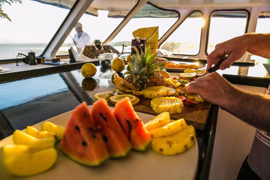 A fresh fruit platter being prepared on board